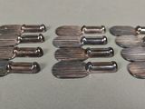 six pieces of metal that have been placed on a table
