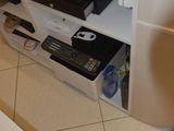 a computer desk with a keyboard and a monitor on top of it