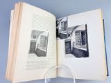 an open book with a magnifying glass on it