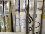 many different types of wrapping paper on a shelf
