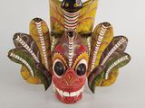 an image of a colorful mask with feathers on a white background
