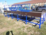 a truck that is parked next to a blue bench