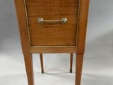 an image of a small wooden table with a drawer on it
