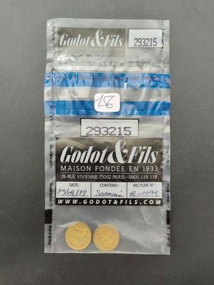 a close up of two coins in a bag on a table