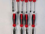 six red and black tools are lined up on a white surface