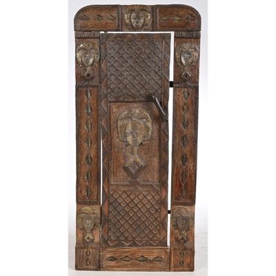 an old wooden door with carvings and carvings on it