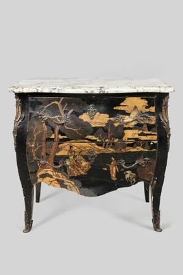 a black and gold chest of drawers with a marble top