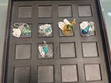 a display case with many different rings in it