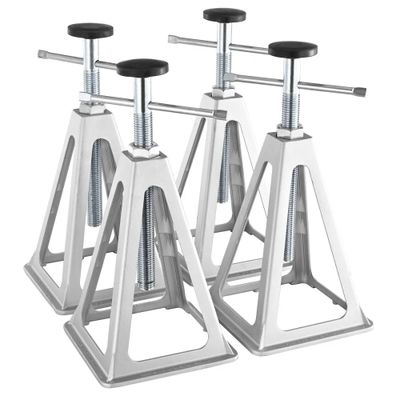 two white metal stands with black seats on them on a white background