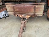 an old wooden wagon sitting in a garage