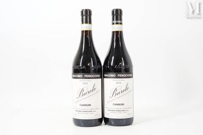 two bottles of wine sitting next to each other on a white surface