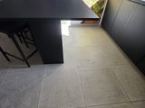 a black table with a laptop on it in a room