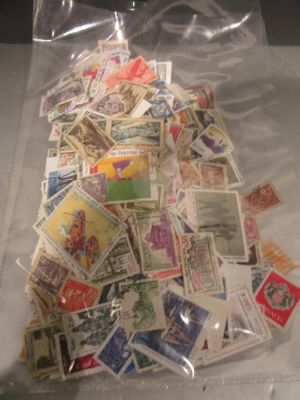 a bag full of stamps sitting on a table