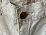 the back of a pair of white jeans with a label on it