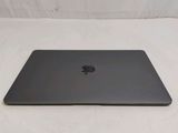 an apple macbook pro laptop sitting on top of a white surface
