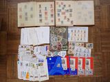 a lot of stamps and envelopes on the floor