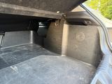 the back of a car with the trunk open showing the cargo compartment