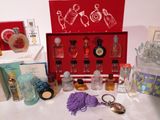 a red box with a lot of perfumes on it