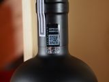 a bottle of wine that is sitting on a table