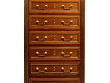 a wooden chest of drawers with a marble top
