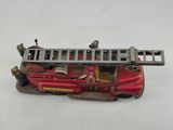 a toy fire truck with a ladder on it