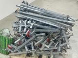 a pile of metal items on a pallet in a room