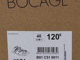 a box with a shoe on it that has a price tag on it