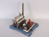 a small model of a steam engine on a blue platform