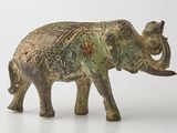 statue of an elephant on a white surface with a white background