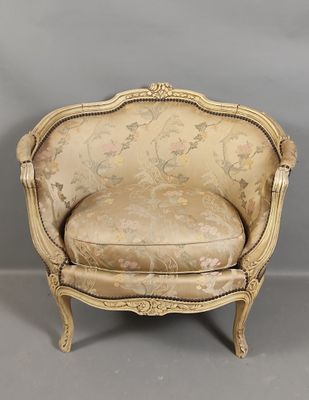 an antique chair with a floral upholstered back and a gold upholstered seat