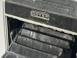 a black and white photo of an old camera
