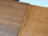 a close up of a wooden table with a mouse on top of it