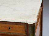 a marble top on the top of a wooden dresser