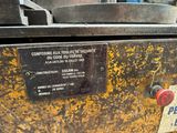 a sign on the side of a machine that says please