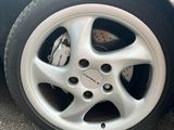 a close up of a car ' s tire on the street