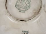 a white plate with a green design on it