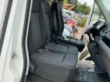 a white van with black seats in the back of it