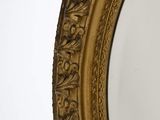 a mirror that is sitting on the wall in the room