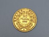 an image of a gold coin with a wreath on it