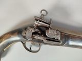 a gun that is sitting on top of a table