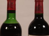 two bottles of wine sitting next to each other on a table