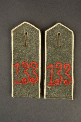 two tags with the numbers 123 and 123 on them