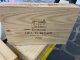 a wooden box with a picture of a house on it