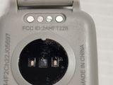 a close up of a cell phone that is on a table