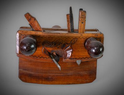 a wooden box with a bunch of tools inside of it