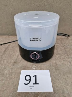 an image of a blender sitting on top of a table next to a price tag