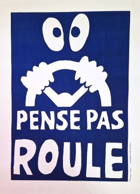 a blue poster with a picture of a face on it