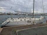 a white sailboat that is docked in the water