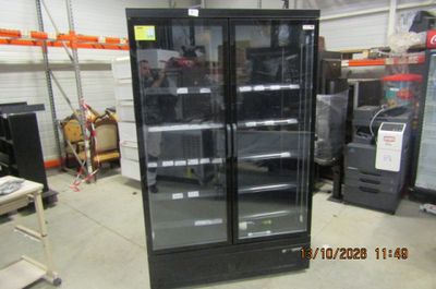 a refrigerator that is sitting in the middle of a room