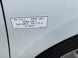 a sticker on the side of a white car